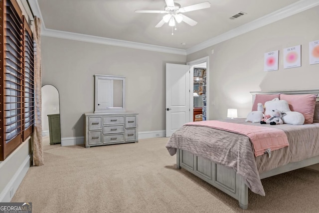 carpeted bedroom featuring ornamental molding and ceiling fan