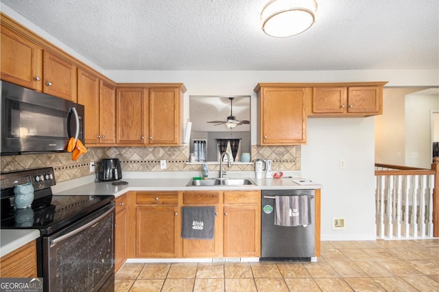 118 Gilberts Way, Temple, GA 30179 - kitchen featuring black appliances, a sink, brown cabinetry, tasteful backsplash, and a textured ceiling