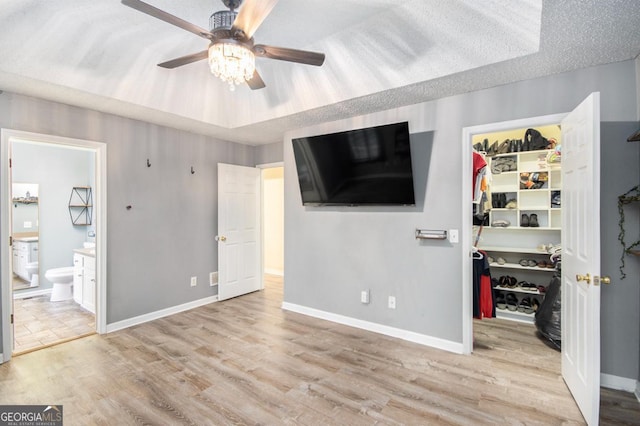 118 Gilberts Way, Temple, GA 30179 - unfurnished bedroom with a walk in closet, a closet, wood finished floors, baseboards, and ensuite bathroom