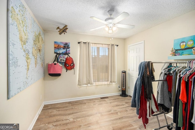 interior space featuring ceiling fan and light wood-type flooring