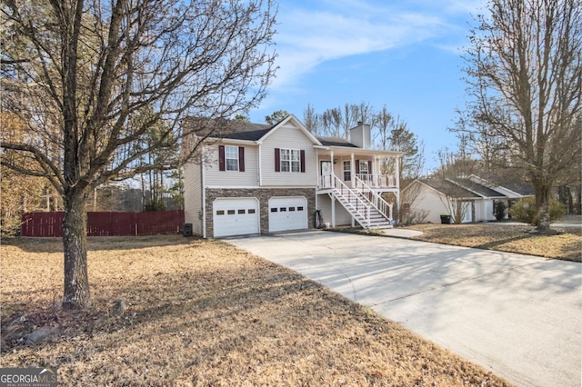 118 Gilberts Way, Temple, GA 30179 - view of front of house with covered porch, stairs, driveway, a chimney, and a garage