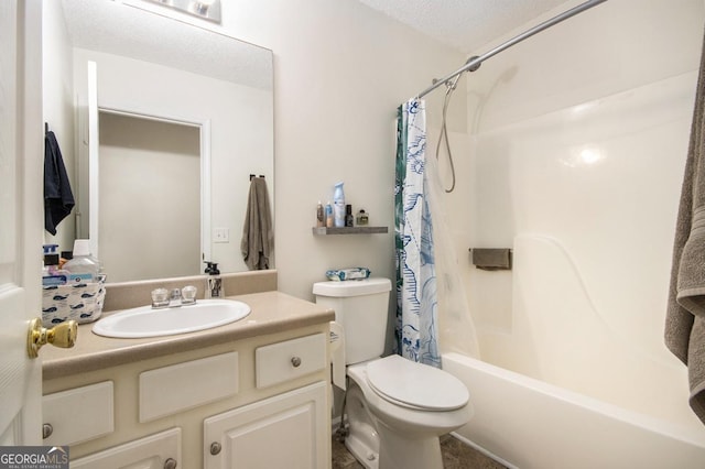 full bathroom featuring vanity, shower / tub combo, toilet, and a textured ceiling