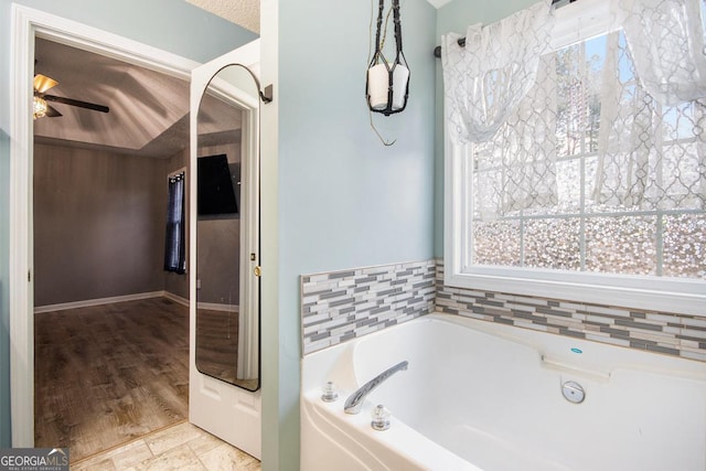 118 Gilberts Way, Temple, GA 30179 - bathroom featuring a bath and ceiling fan