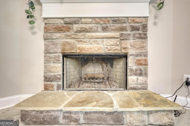 room details featuring a stone fireplace