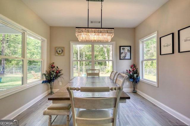 dining area with hardwood / wood-style flooring