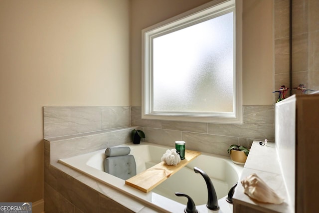 bathroom featuring tiled bath