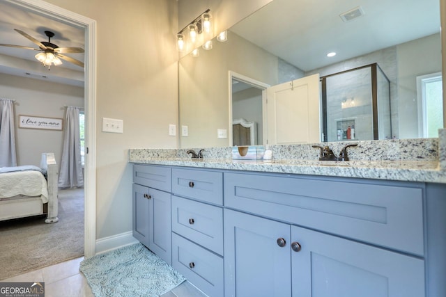 bathroom featuring tile patterned flooring, vanity, an enclosed shower, and ceiling fan