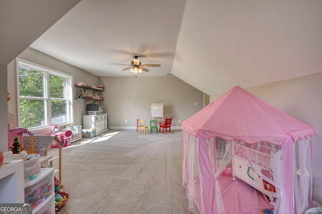 recreation room with vaulted ceiling, carpet floors, and ceiling fan