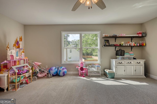 playroom with light colored carpet and ceiling fan