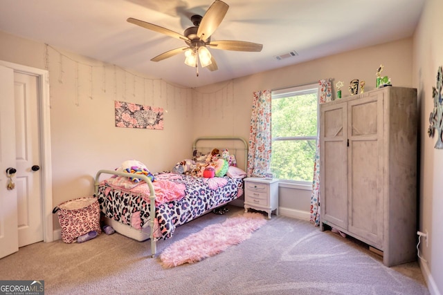 carpeted bedroom featuring ceiling fan