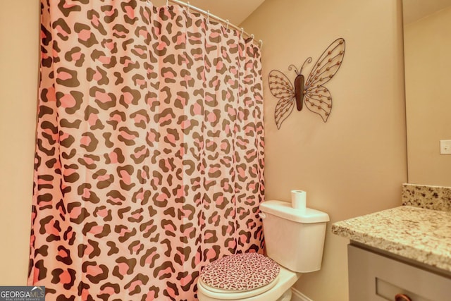 bathroom with vanity and toilet