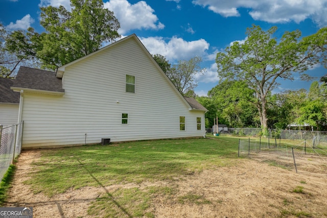 back of house featuring a yard