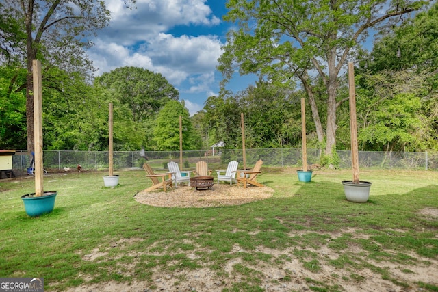 view of yard with an outdoor fire pit