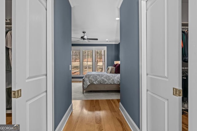 bedroom featuring hardwood / wood-style floors and crown molding