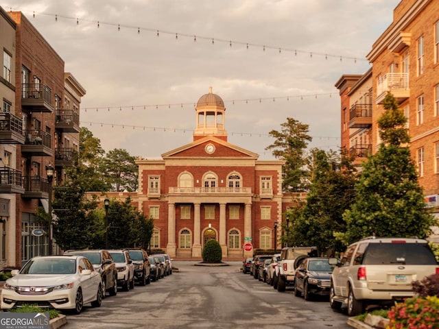 view of outdoor building at dusk