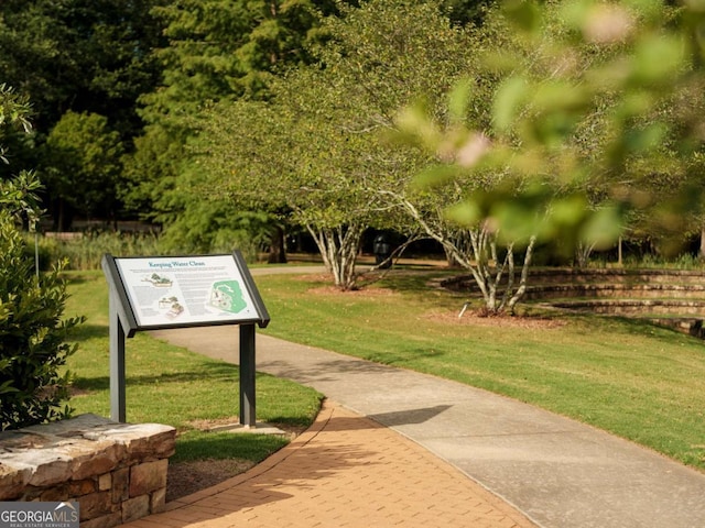 view of community featuring a lawn