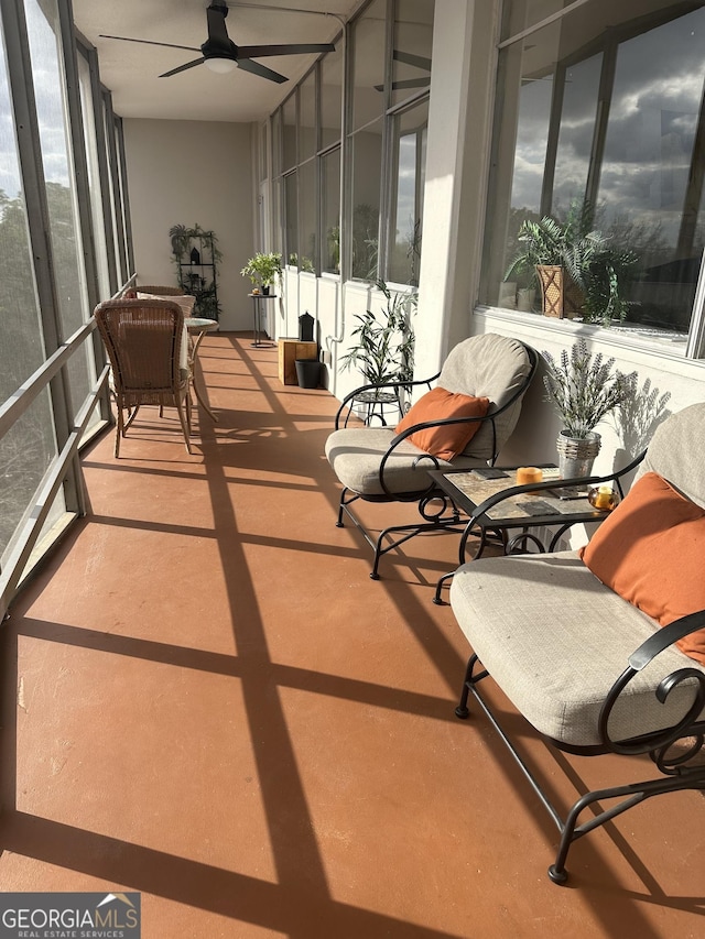 sunroom / solarium with a wealth of natural light and ceiling fan