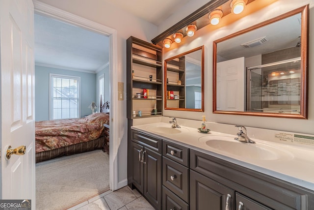 bathroom featuring vanity, tile patterned floors, ornamental molding, and walk in shower