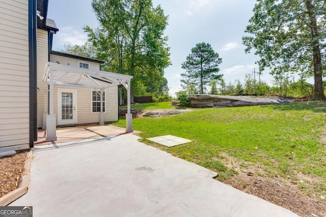 view of yard with a pergola and a patio area