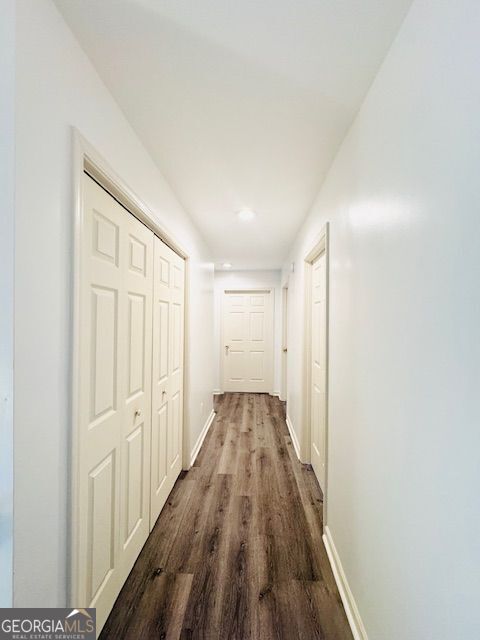 hall featuring dark wood-type flooring