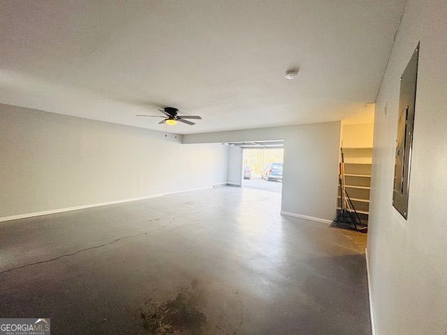 interior space with concrete floors and ceiling fan