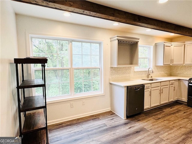 kitchen featuring sink, dishwasher, light hardwood / wood-style floors, white cabinets, and beamed ceiling