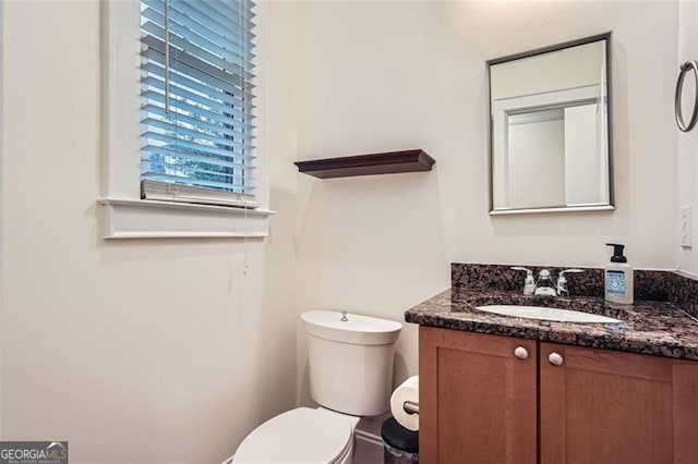 bathroom with vanity and toilet