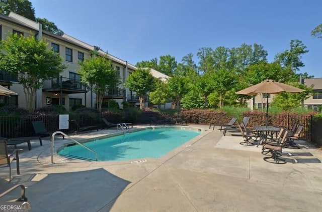 view of pool featuring a patio