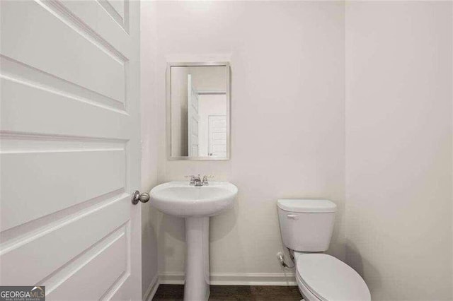 bathroom with sink and toilet