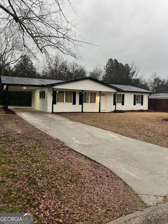 view of front of house with a carport and covered porch