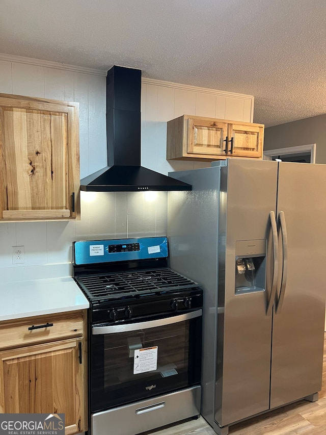 kitchen featuring range hood, backsplash, stainless steel appliances, a textured ceiling, and light wood-type flooring