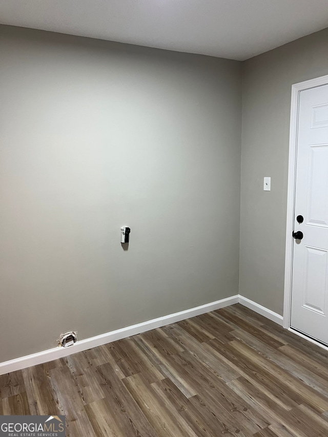 spare room with dark wood-type flooring