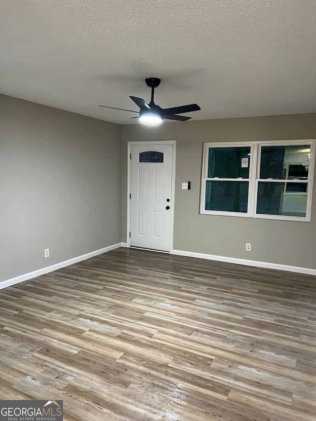 interior space featuring ceiling fan