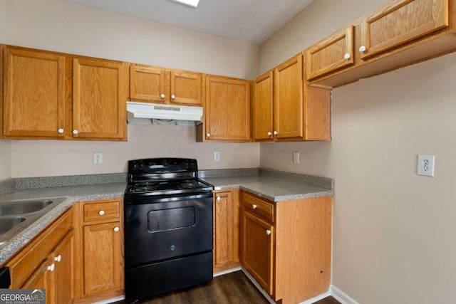 kitchen featuring black range with electric stovetop, sink, and dark wood-type flooring