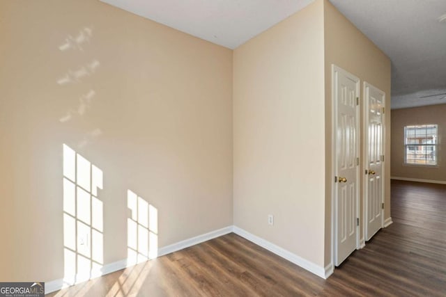 hall with dark hardwood / wood-style flooring