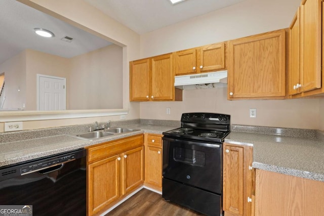 kitchen with sink, dark hardwood / wood-style floors, and black appliances