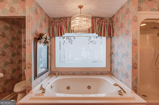 bathroom featuring independent shower and bath, a chandelier, and toilet