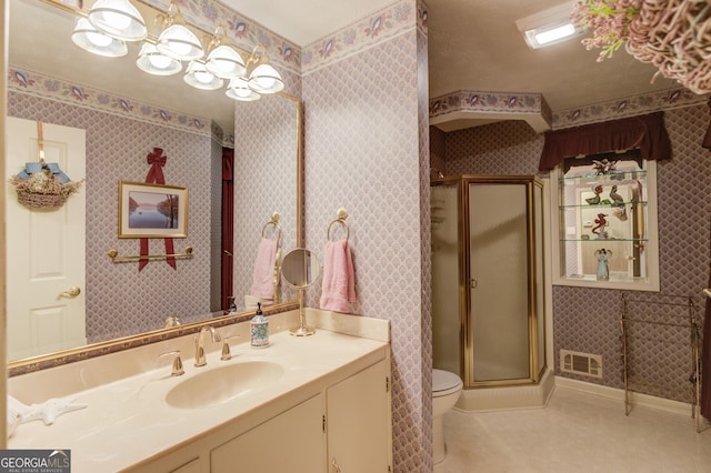 bathroom with vanity, an enclosed shower, tile patterned floors, and toilet