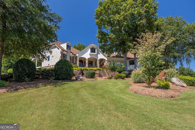 view of front of property with a front lawn