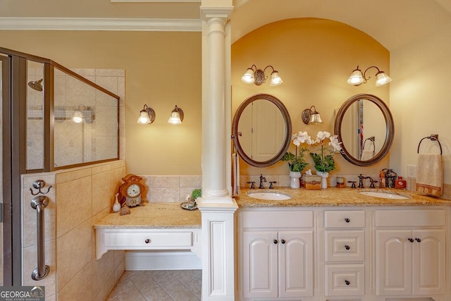 bathroom featuring ornate columns, vanity, ornamental molding, tile patterned floors, and walk in shower