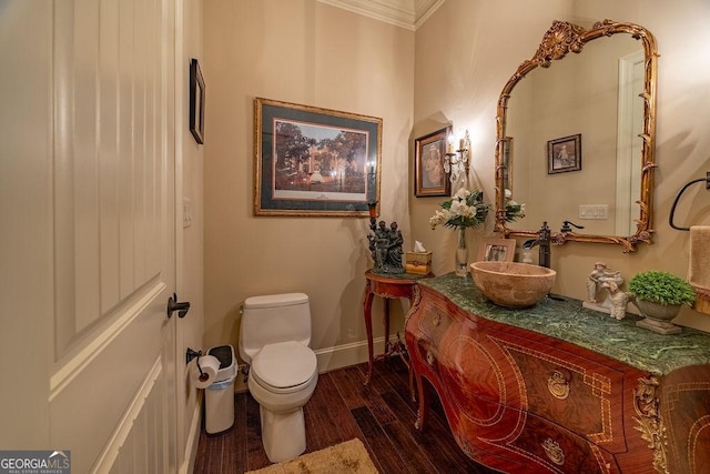 bathroom featuring hardwood / wood-style flooring, vanity, and toilet