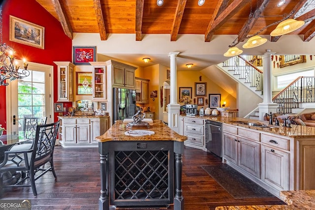 kitchen with sink, a center island, stainless steel fridge, dishwasher, and decorative columns