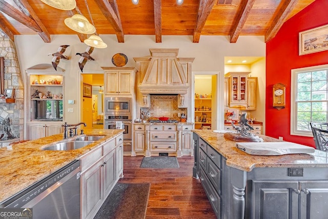 kitchen with appliances with stainless steel finishes, sink, hanging light fixtures, light stone countertops, and wooden ceiling