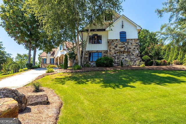 view of front of home with a front lawn