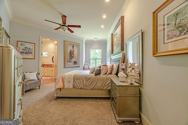 carpeted bedroom with ornamental molding and connected bathroom