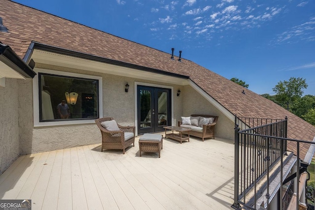 deck with an outdoor living space and french doors