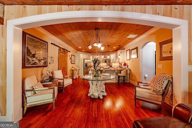 interior space with ornamental molding, dark hardwood / wood-style flooring, and wooden ceiling