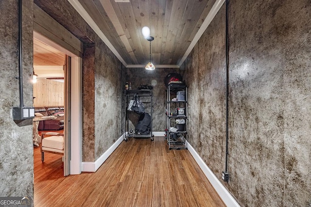 hallway featuring hardwood / wood-style floors and wood ceiling