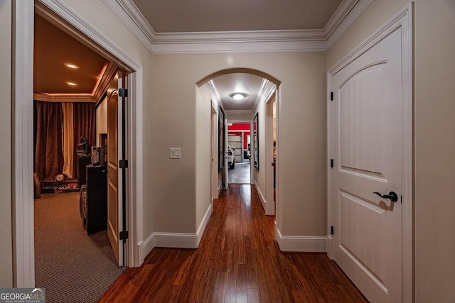 corridor featuring ornamental molding and dark hardwood / wood-style floors