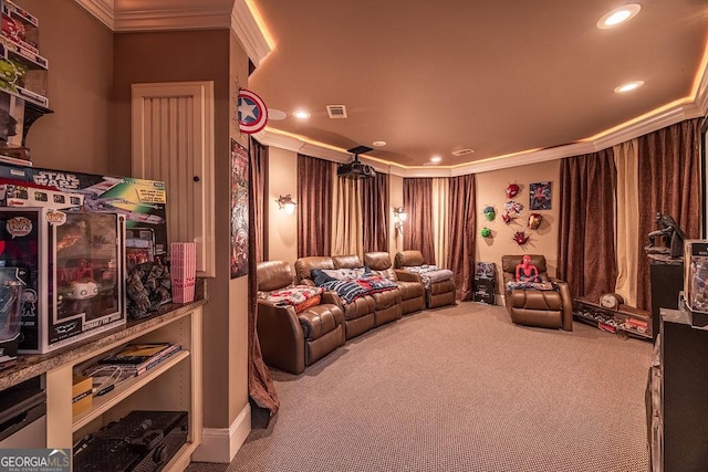 home theater room featuring crown molding and carpet